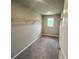 Walk-in closet with shelving and a window at 223 Willow St, Canton, GA 30114