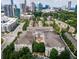A stunning aerial view of a townhome community with the city skyline in the background at 3635 E Paces Ne Cir # 1405, Atlanta, GA 30326