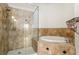 Elegant primary bath features a soaking tub with tile surround and glass enclosed shower at 3635 E Paces Ne Cir # 1405, Atlanta, GA 30326