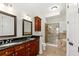 Elegant bathroom features dual sinks, granite counters, custom cabinets and a glass enclosed shower at 3635 E Paces Ne Cir # 1405, Atlanta, GA 30326