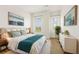 Cozy bedroom featuring bright natural light, calming artwork, and stylish modern furniture at 3635 E Paces Ne Cir # 1405, Atlanta, GA 30326