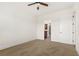 Bright bedroom featuring neutral carpet, ceiling fan and ensuite bathroom entrance at 3635 E Paces Ne Cir # 1405, Atlanta, GA 30326