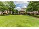 Expansive, well-manicured green space in a community with a charming gazebo and mature trees at 3635 E Paces Ne Cir # 1405, Atlanta, GA 30326
