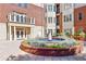 Elegant entrance with decorative fountain, lush landscaping, and a well-maintained facade at 3635 E Paces Ne Cir # 1405, Atlanta, GA 30326