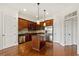 Kitchen with stainless steel appliances, island, wooden cabinets and hardwood floors at 3635 E Paces Ne Cir # 1405, Atlanta, GA 30326