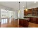 Modern kitchen with wooden cabinets, granite countertops, and stainless steel appliances at 3635 E Paces Ne Cir # 1405, Atlanta, GA 30326