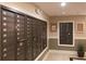 Community mailboxes inside a neutral hallway with indoor lighting and surveillance camera at 3635 E Paces Ne Cir # 1405, Atlanta, GA 30326