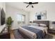 Cozy bedroom with a ceiling fan, soft rug, large window and stylish decor creating a serene atmosphere at 3635 E Paces Ne Cir # 1405, Atlanta, GA 30326