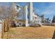 Back view of two story home with white siding, deck, and fenced yard at 4381 Prather Son Dr, Loganville, GA 30052