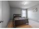 Cozy bedroom with a large bed, window, and neutral gray paint for a calming atmosphere at 4381 Prather Son Dr, Loganville, GA 30052