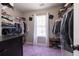 Walk-in closet with shelving on three walls, lots of extra storage space and a purple rug at 4381 Prather Son Dr, Loganville, GA 30052