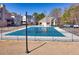 Fenced community pool with lounge chairs, cabana, and wooded area at 4381 Prather Son Dr, Loganville, GA 30052
