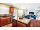 Spacious eat-in kitchen flows into a cozy living room with fireplace and lots of natural light at 4381 Prather Son Dr, Loganville, GA 30052