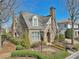 Charming brick home with a stone chimney and well-manicured landscaping at 460 High Pointe Trl, Roswell, GA 30076