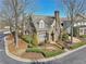 Beautiful brick home with a landscaped front yard and mature trees on a corner lot at 460 High Pointe Trl, Roswell, GA 30076