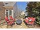 Outdoor patio area with stone flooring, comfortable seating, and a tranquil garden setting at 460 High Pointe Trl, Roswell, GA 30076