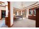 Spacious main bedroom featuring tray ceiling, large windows, and walk-in closet with custom shelving at 5301 Hill Nw Rd, Acworth, GA 30101