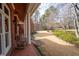 Inviting brick porch with rocking chairs and a view of the landscaped front yard at 5301 Hill Nw Rd, Acworth, GA 30101