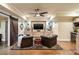 Basement entertaining area features a wet bar, custom cabinets, wood floors, and comfortable seating at 1207 Thornwell Ne Dr, Brookhaven, GA 30319