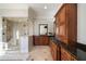 Elegant bathroom featuring a glass shower, granite countertops, and custom wood cabinets, offering style and functionality at 1207 Thornwell Ne Dr, Brookhaven, GA 30319