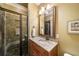 Bathroom features a walk-in shower with slate tile, granite counters, and wood cabinets at 1207 Thornwell Ne Dr, Brookhaven, GA 30319