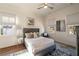 Bright bedroom with a queen bed, neutral decor, and natural light from multiple windows at 1207 Thornwell Ne Dr, Brookhaven, GA 30319