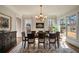 Elegant dining room with hardwood floors, chandelier, and large windows at 1207 Thornwell Ne Dr, Brookhaven, GA 30319
