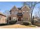 Attractive two-story brick home with a well-manicured lawn and inviting entrance at 1207 Thornwell Ne Dr, Brookhaven, GA 30319