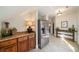 Hallway with stainless steel refrigerator, and counter with wooden cabinets and granite countertop at 1207 Thornwell Ne Dr, Brookhaven, GA 30319