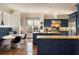 Spacious blue kitchen with granite countertops, stainless steel appliances, and a cozy breakfast nook at 1207 Thornwell Ne Dr, Brookhaven, GA 30319