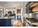 Modern kitchen with stainless steel appliances, granite countertops, and an open view into the living room at 1207 Thornwell Ne Dr, Brookhaven, GA 30319