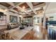 Expansive living room with hardwood floors, coffered ceilings, and plenty of natural light at 1207 Thornwell Ne Dr, Brookhaven, GA 30319