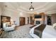 Spacious main bedroom featuring fireplace, sitting area, and walk-in closets at 1207 Thornwell Ne Dr, Brookhaven, GA 30319