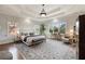 Bright and airy primary bedroom with tray ceilings, large windows, and a sitting area at 1207 Thornwell Ne Dr, Brookhaven, GA 30319