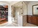 Elegant bathroom featuring a glass shower, and view into the custom shoe closet, offering style and functionality at 1207 Thornwell Ne Dr, Brookhaven, GA 30319