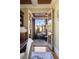 Bright sunroom with stone flooring and ample natural light, accessed through french doors from the office at 1207 Thornwell Ne Dr, Brookhaven, GA 30319