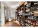 Spacious walk-in closet with custom built-in shelving and a variety of shoe and accessory storage options at 1207 Thornwell Ne Dr, Brookhaven, GA 30319
