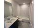 Modern bathroom featuring a tiled shower, sleek vanity, and stylish fixtures at 219 Willow St, Canton, GA 30114