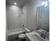 Modern bathroom featuring a tiled shower, sleek vanity, and stylish fixtures at 219 Willow St, Canton, GA 30114