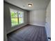 Cozy bedroom with plush carpeting and a window with outdoor views at 219 Willow St, Canton, GA 30114