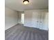 Comfortable bedroom with plush carpeting and ample closet space at 219 Willow St, Canton, GA 30114
