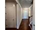 Inviting entryway featuring hardwood flooring, a staircase, and a charming front door with glass panels at 219 Willow St, Canton, GA 30114