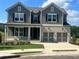 Charming two-story home featuring a brick facade and a two-car garage at 219 Willow St, Canton, GA 30114