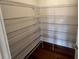 Walk-in pantry with ample shelving, offering plenty of storage space at 219 Willow St, Canton, GA 30114