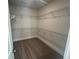 Spacious walk-in closet featuring carpeted floor and multiple rows of wire shelving at 219 Willow St, Canton, GA 30114