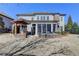 Home exterior featuring a backyard patio with a fire pit and a screened-in porch at 3905 Alister Park Dr, Cumming, GA 30040