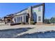 Backyard of home featuring a fire pit, screened-in porch, and landscaped lawn at 3905 Alister Park Dr, Cumming, GA 30040