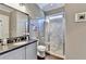 Bathroom featuring granite vanity, toilet, and glass-enclosed shower at 3905 Alister Park Dr, Cumming, GA 30040