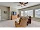 Upstairs bonus room with seating, TV and lots of natural light at 3905 Alister Park Dr, Cumming, GA 30040