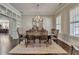 Dining room featuring hardwood floors, a decorative chandelier and a large window at 3905 Alister Park Dr, Cumming, GA 30040